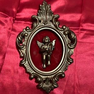 Vintage plastic gold frame with red velvet and angel